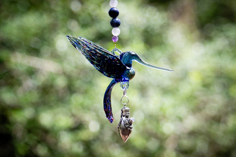 hummingbird with silver keepsake pendant